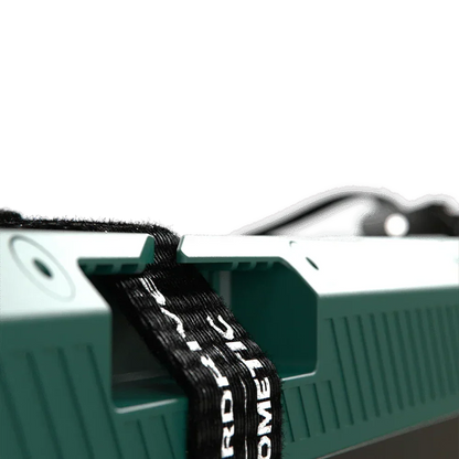 Close-up of Off-Grid 12V vehicle accessory with rugged handle and black securing strap
