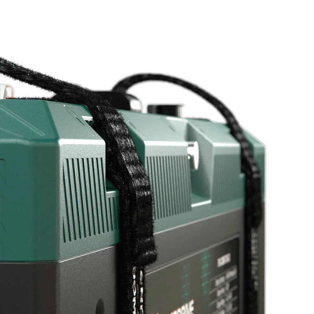 Close-up of a portable 12V off-grid battery box with carry strap and teal top.